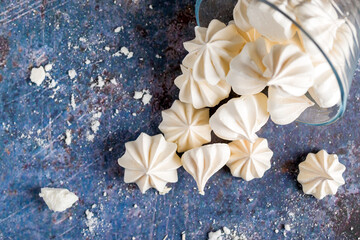 small white meringues on a colored background