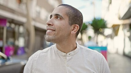 Poster - Young hispanic man smiling confident standing at street