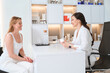 © Viacheslav Yakobchuk - Woman esthetician consults a client in a cosmetology clinic