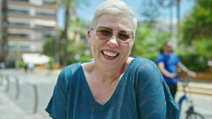 Wall Mural - Middle age grey-haired woman laughing a lot at street