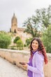 © Sangiao_Photography - Smartphone technology holiday vacation. Latin American mid-female. Lifestyle photo in Salamanca.