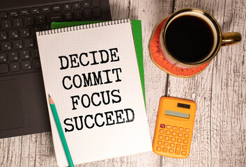 Wall Mural - Motivational and inspirational quote Decide, commit, focus, succeed written on wooden blocks.