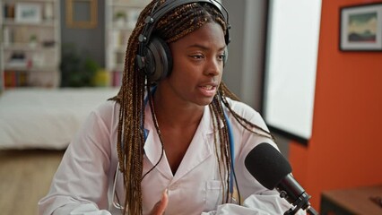 Wall Mural - African american woman doctor having interview at radio studio