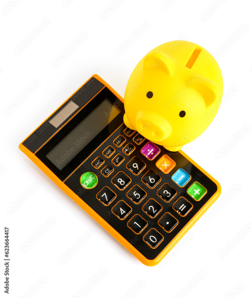 Yellow piggy bank with calculator isolated on white background