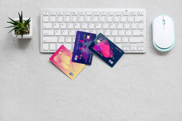 Poster - Keyboard with different credit cards and computer mouse on grunge grey background