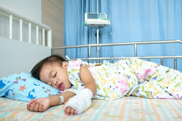 A 1.5-year-old Asian boy is sick and hospitalized sleeping.