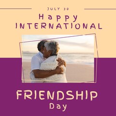 Wall Mural - Happy international friendship day text with happy diverse senior man and woman embracing on beach