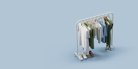 Rack with clothes and shoes over blue background