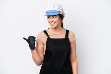 Wall Mural - Fishmonger brazilian woman wearing an apron isolated on white background pointing to the side to present a product