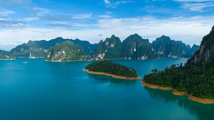 Aerial view at Khao Sok national park Cheow Lan Dam lake with blue sky background  in Surat Thani, Thailand