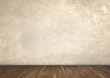 © WONGSAKORN - background for photo studio with wooden floor and beige concrete backdrop. empty cement wall room studio background and floor perspective, well editing montage for product displayed.