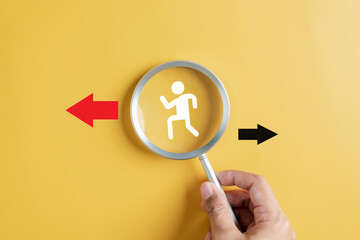 Fototapete - Businessperson following Red arrow and different direction facing opposite direction with black arrow for business disruption and technology transformation and different thinking idea concept.