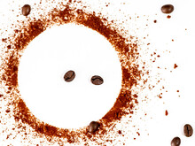 Closeup Shot Of Coffee Powder Circle On White Background With Roasted Beans.