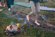 Coal walking or fire walking. Barefoot person on burned wood and hot embers. Training willpower and strength for healing. initiation and faith