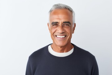 Portrait of smiling mature man in eyeglasses against white background