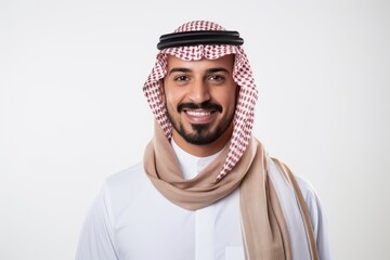 Portrait of a smiling arabian man standing over white background