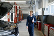 © Nomad_Soul - Professional handsome male car mechanic walking along service station