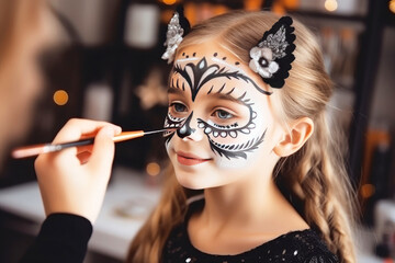 Mom paints her daughter's face on Halloween