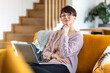 © leszekglasner - Woman with laptop at home focus and planning