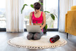 © leszekglasner - Slim sporty woman at home checking exercises plan on laptop before workout