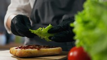 Ingredients, Grill Chef Is Deeply Involved Put Green Fresh Salad In The Food Preparation Area. General Angle Responsible Culinary Specialist Is At The Workplace For Vegans, Sandwich Shop
