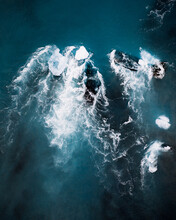 Icebergs In The Surf Of Water From Above