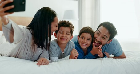 Poster - Family selfie, laughing and in a home bedroom for a memory, happy and comedy together. Smile, love and a young mother, father and children taking a photo on a bed in the morning for care and fun