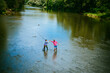 © Volodymyr - Father and mature son fisherman fishing with a fishing rod on river.
