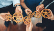 © Summit Art Creations - Office worker holding cog wheel as unity and teamwork in corporate workplace concept. Diverse colleague business people showing symbol of visionary system and mechanism for business success. Concord
