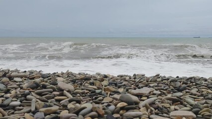 Poster - sea with waves in cloudy weather.