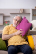 © Elnur - Old man with many pillows at home