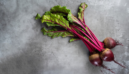 Wall Mural - Beet, beetroot bunch on grey stone background. Copy space. Top view.