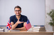 © Elnur - Male English language teacher in front of white board
