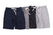 © Kitti bowornphatnon - Group of White, grey, blue and black shorts pants isolated on background