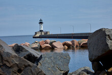 Historic Lighthouse On A Calm Summer Day In The Duluth Minnesota Harbor On Lake Superior USA