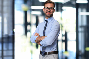 Sticker - Young handsome businessman smiling in an office environment