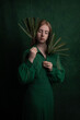 © Milou Dirks - classic art portrait of a woman in green dress holding leaves in renaissance style