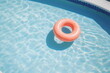 inflatable pink ring floating on blue pool surface in sunshine with nobody, made with generative ai