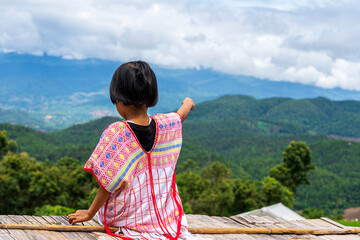 Wall Mural - Pakhayo girl looking to beautiful rice terraces. Ban Pa Bong Piang That has the most beautiful rice terraces in Thailand.