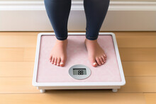 Top View Crop Faceless Barefoot Female Standing At Morning On Digital Weight And Body Fat Scales With Display