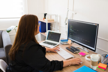 plus size programmer coding on the computer
