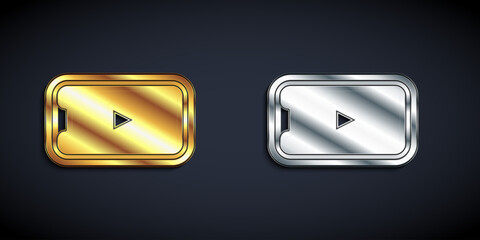 Poster - Gold and silver Online play video icon isolated on black background. Smartphone and film strip with play sign. Long shadow style. Vector