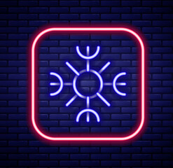 Sticker - Glowing neon line Snowflake icon isolated on brick wall background. Colorful outline concept. Vector