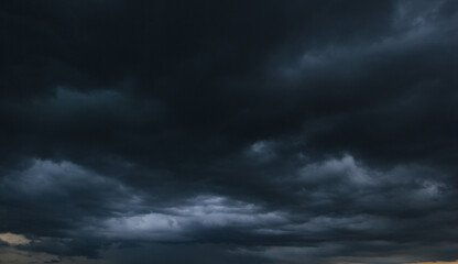 Aufkleber - The dark sky with heavy clouds converging and a violent storm before the rain.Bad or moody weather sky and environment. carbon dioxide emissions, greenhouse effect, global warming, climate change