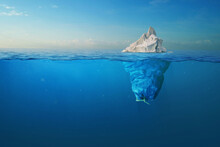 Iceberg - Plastic Bag With A View Under The Water. Pollution Of The Oceans. Plastic Bag Environment Pollution With Iceberg. The Tip Of The Iceberg And A Plastic Bag Full Of Trash