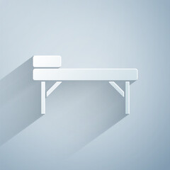 Poster - Paper cut Massage table icon isolated on grey background. Paper art style. Vector