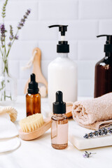 Wall Mural - Bottles lavender shampoo or shower gel Lotion, essential oil, cream, massage brushes, Body and face care beauty bath set	