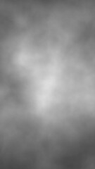 Sticker - realistic black and white blurred smoke loop vertical background.