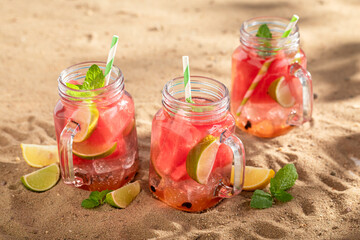 Wall Mural - Fresh lemonade with crushed ice and fruits in a jar.