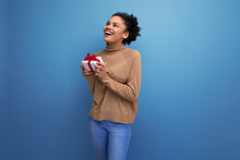 Isolated Background, Cute Young Brunette Hispanic Woman With Hairstyle Received A Gift For Holiday Birthday